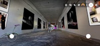 a hallway with a lot of pictures hanging on the walls